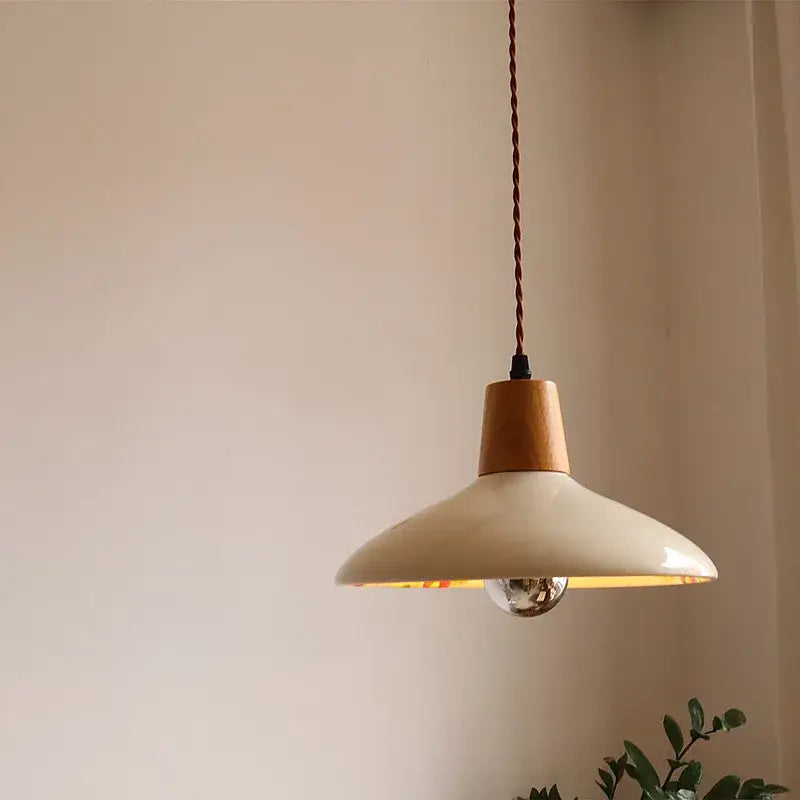 Modern cream ceramic led pendant light with natural wood accent and twisted brown cord for kitchen decorbites ceramic led pendant