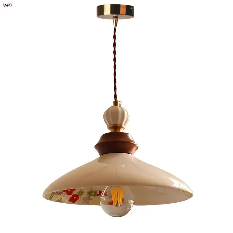 Modern cream ceramic led pendant light with floral pattern inside featuring wooden and brass accents for kitchen decorbites ceramic led pendant