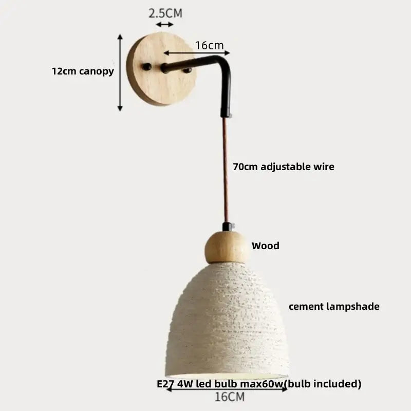 Modern cream ceramic wall lamp with pull chain switch featuring a wood canopy black metal arm and off-white cement shade