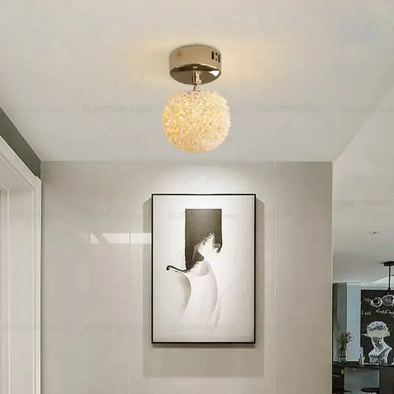 Modern cream crystal round room chandelier with gold-toned spherical frame and clear decorbites crystal round beads