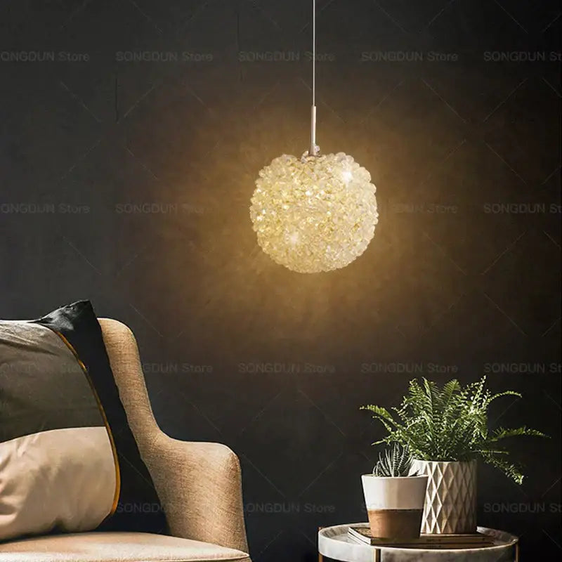 Modern cream crystal round room chandelier featuring a delicate faceted golden-hued decorbites crystal round design