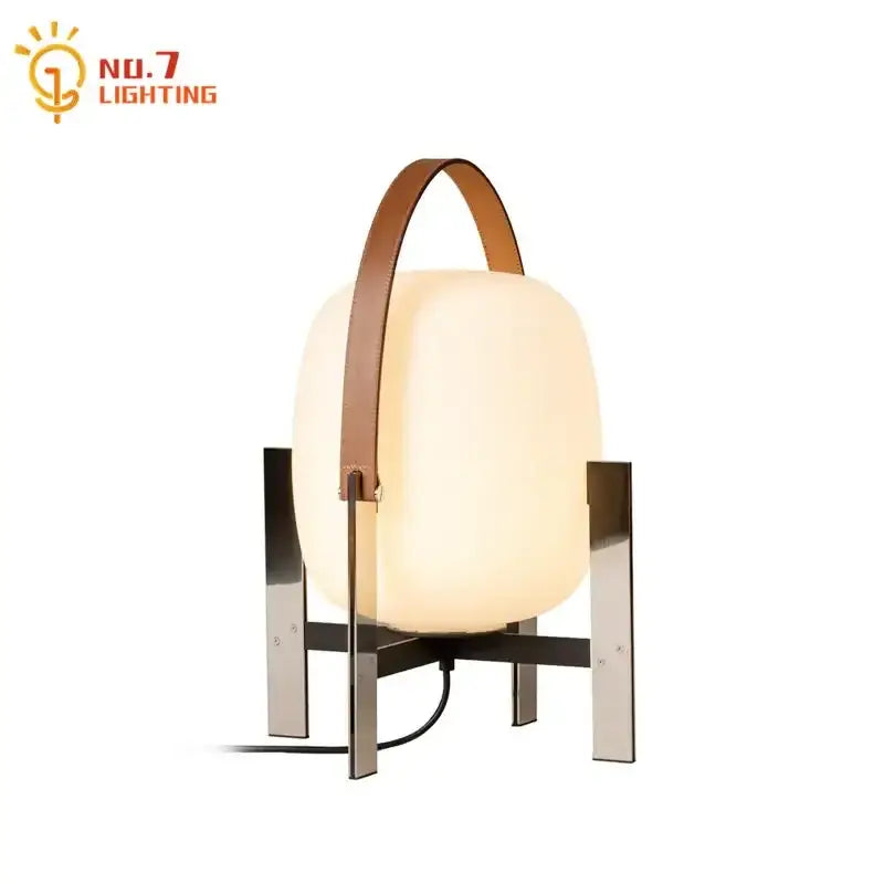 Modern cream designer metal glass table lamp with frosted finish and brown leather handle by no.7 lighting for bedroom decorbites designer metal