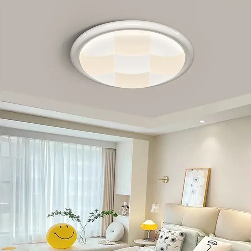 Modern cream geometric led ceiling lights with a white circular design and soft diffused glow for bedroom lighting