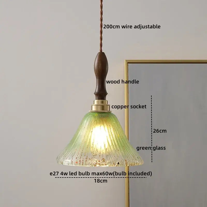 Vintage-style pendant light with textured green glass shade dark wood handle and brass copper led socket for dining room