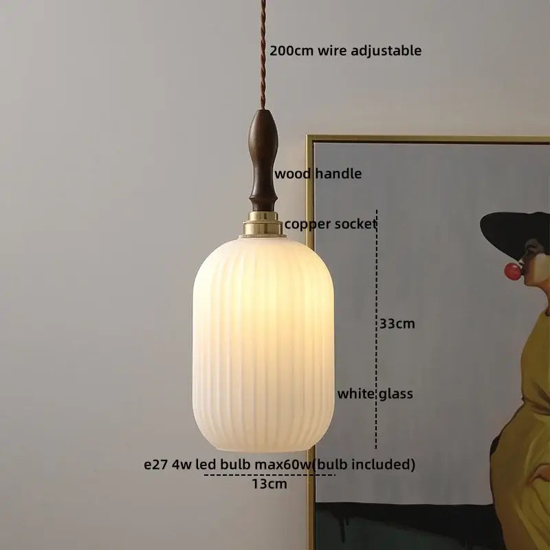 Modern cream glass copper led pendant light with a white ribbed shade and dark wood handle for dining room lighting