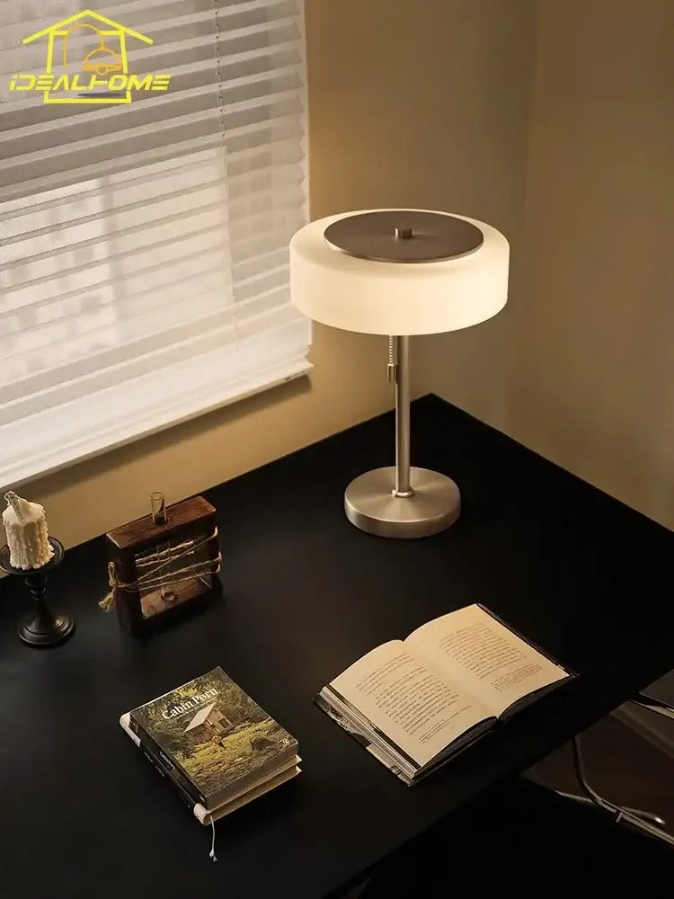 Modern cream glass table lamp with a sleek white frosted shade and brushed metal base for bedroom decorbites cream glass decor