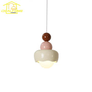 Modern cream and pink stacked resin pendant light with pastel ceramic shades for bedroom decorbites cream wind