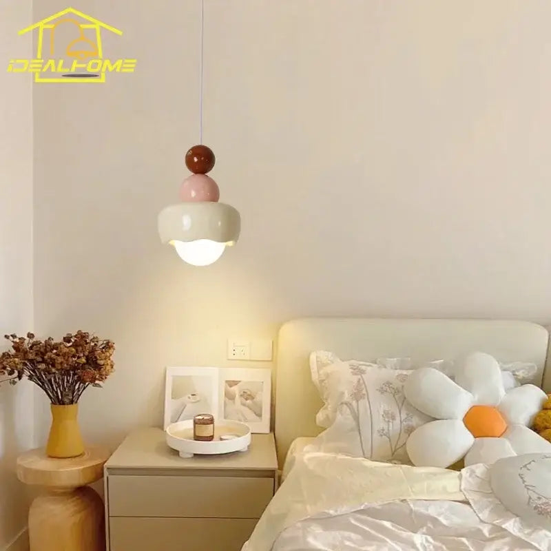 Modern cream and pink stacked resin pendant light with spherical elements for bedroom decorbites cream wind