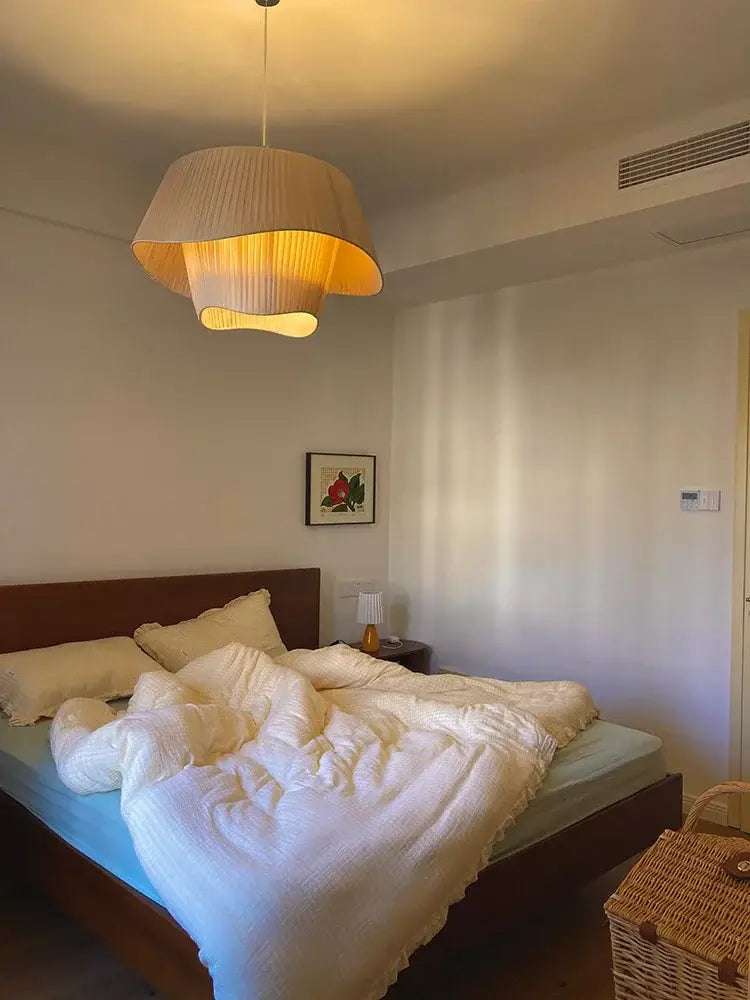 A warm beige modern cream pleated pendant light with layered fabric design by decorbites designer led for bedrooms