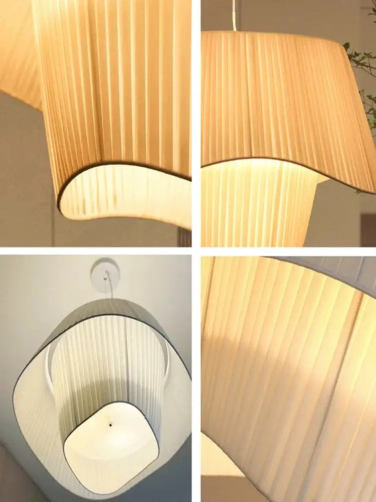 Modern cream pleated designer led fabric pendant light with warm tones and soft curved silhouette for bedroom decorbites