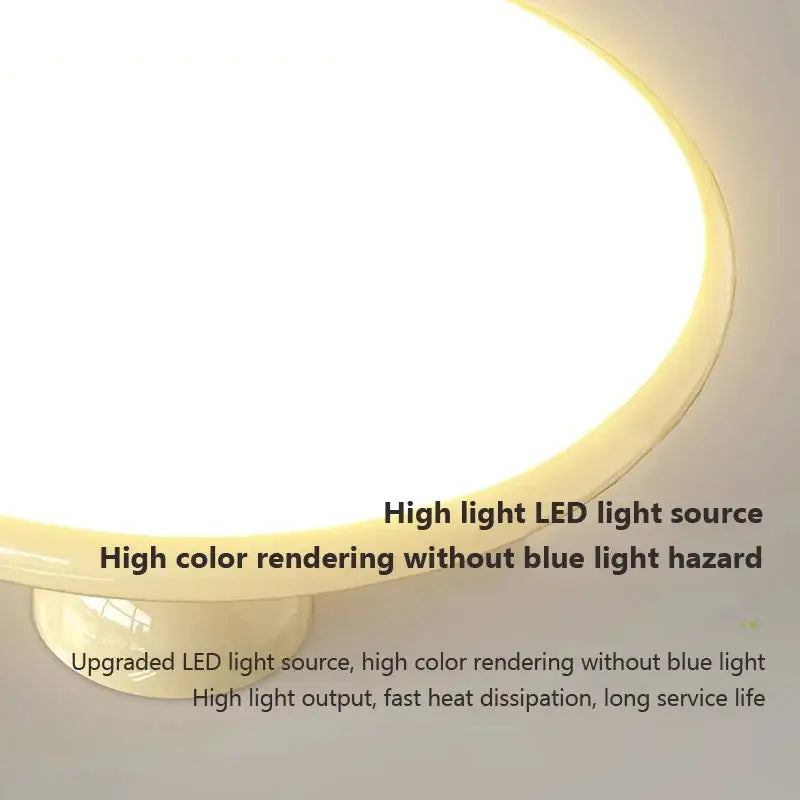 Circular cream iron nordic ceiling light with warm diffused led glow and smooth off-white plastic housing for bedroom decorbites
