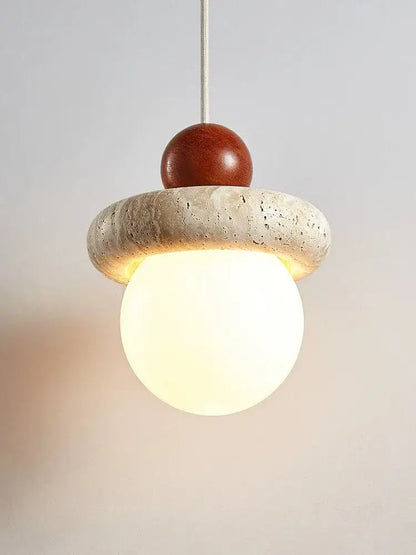 Modern cream stone wood globe pendant light with warm glowing glass bulb in textured cream stone ring for bedroom decorbites cream stone