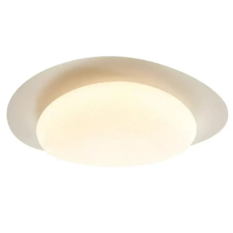 Modern cream style cobblestone ceiling light with oval frosted glass diffuser and sleek metallic frame for bedroom decorbites