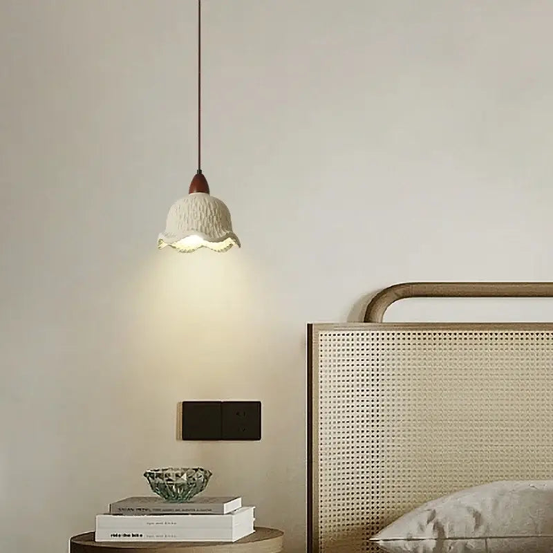 Modern cream textured ceramic pendant lamp with fluted edge and dark wood fixture from decorbites bud micro cement collection