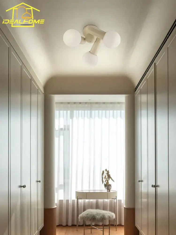 Modern cream wind led ceiling light with three frosted glass globe bulbs for bedroom illumination