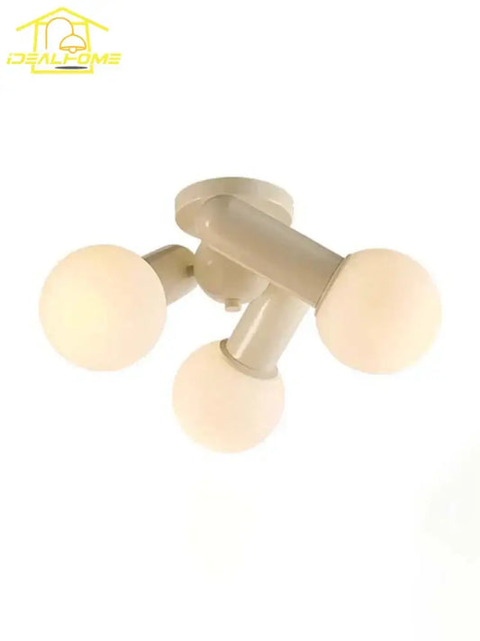 Beige three-light cream wind led ceiling light with frosted glass globe bulbs ideal for bedroom lighting