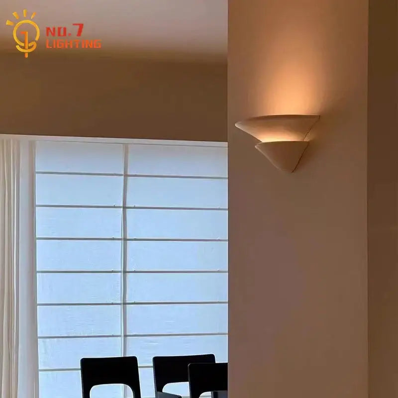 Modern cream wind umbrella design wall lamp with warm-toned, minimalist ceramic finish for bedroom use
