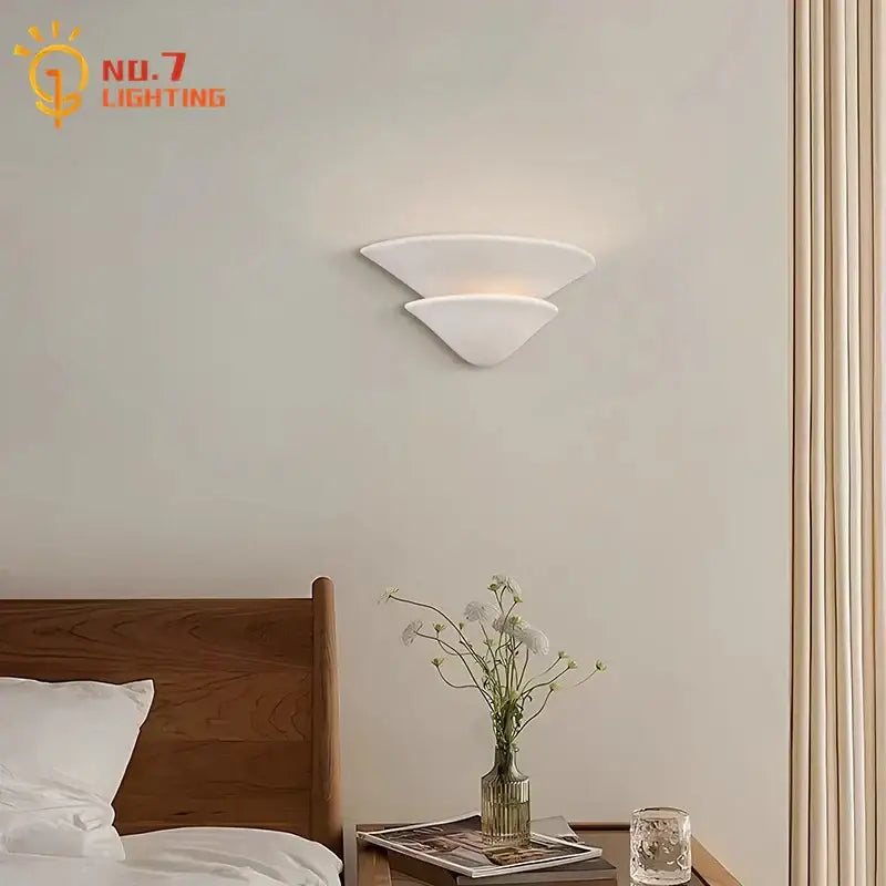 White ceramic wall lamp with cream wind umbrella design and modern layered glass sconce for bedroom lighting