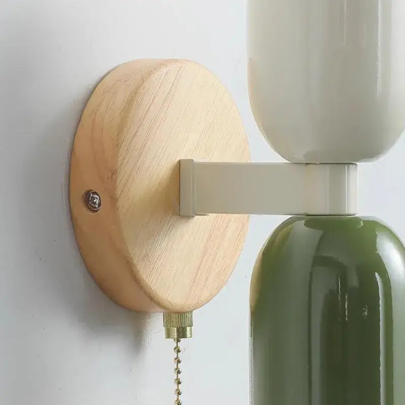 Modern cream zipper wooden wall lamp with light wooden base, off-white arm, and ceramic shades for bedroom illumination