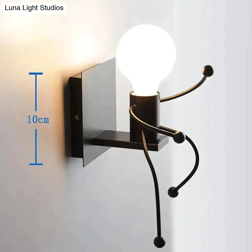 Black metal wall sconce with articulated limbs and exposed bulb showcasing modern creative minimalism design