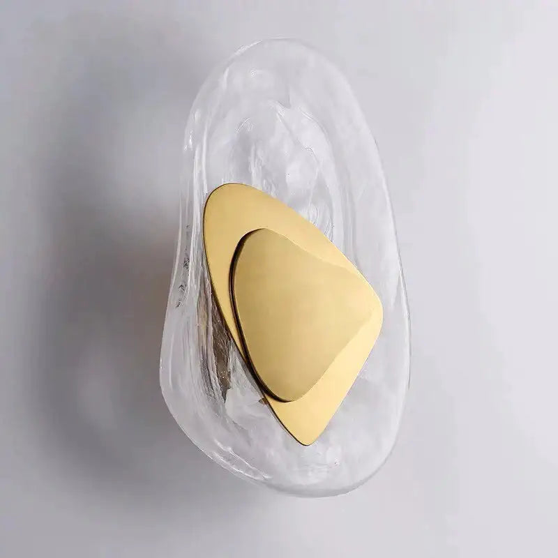 Modern creative minimalist glass wall lamp with gold-toned triangular sconce and translucent organic glass base for bedside lighting
