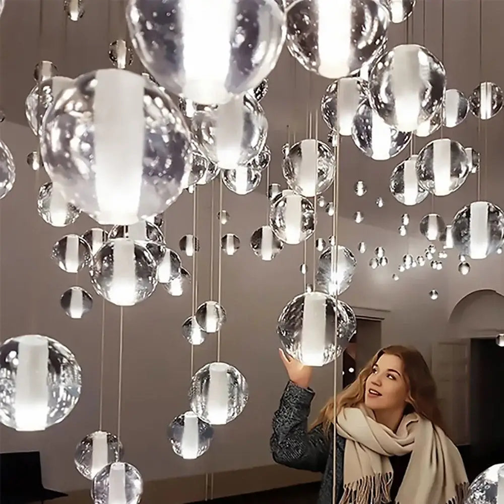 Modern crystal ball led chandelier with reflective glass orbs suspended by cables for living room decorbites crystal ball lighting