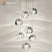 Modern crystal ball nordic led chandelier featuring clear crystal pendant lights with a cascading design for staircase decorbites crystal ball