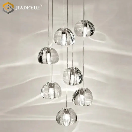 Modern crystal ball nordic led chandelier featuring clear crystal pendant lights with a cascading design for staircase decorbites crystal ball