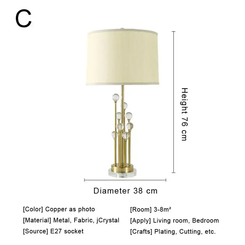 Modern decorbites crystal bedside lamp with gold-toned base, clear crystal accents and cream fabric shade for bedroom decor