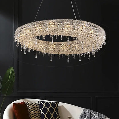 Modern crystal bird nest chandelier with clear faceted crystals cascading in a circular dining room pendant light