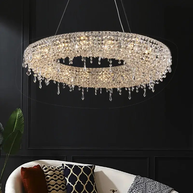 Modern crystal bird nest chandelier with clear faceted crystals cascading in a circular dining room pendant light
