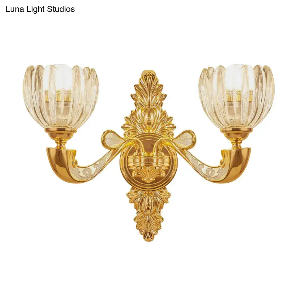 Gold-finished ornate block gold wall lamp fixture with two fluted glass shades for modern bedroom sconce lighting
