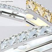 Modern crystal bow bathroom sconce with chrome frame and clear champagne faceted crystals for warm and cool light illumination