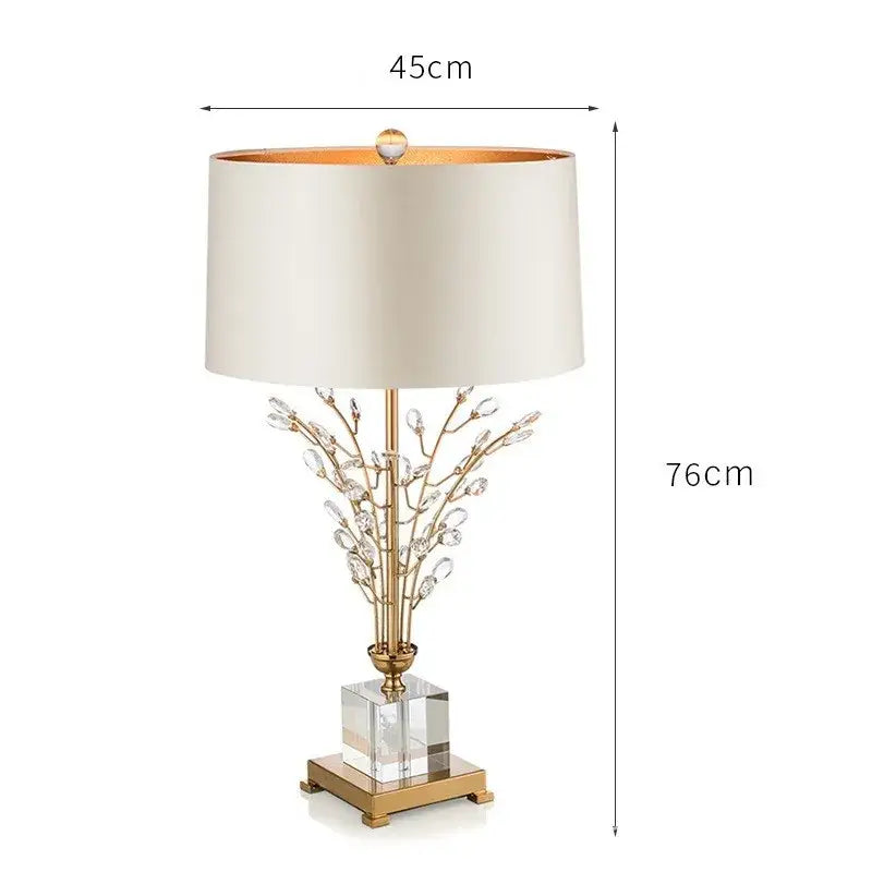 Elegant gold-toned decorbites crystal branch table lamp with cream fabric shade and clear acrylic base for bedroom decor