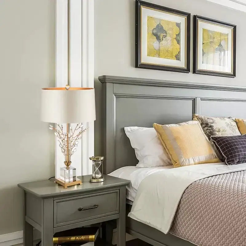 Modern crystal branch table lamp with white fabric shade and clear crystal base featuring gold decorbites crystal branch accents