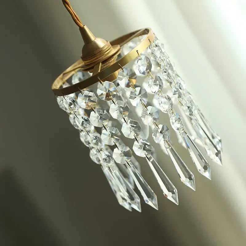 Delicate modern crystal brass led pendant light with cascading clear faceted crystals for dining room decorbites crystal brass