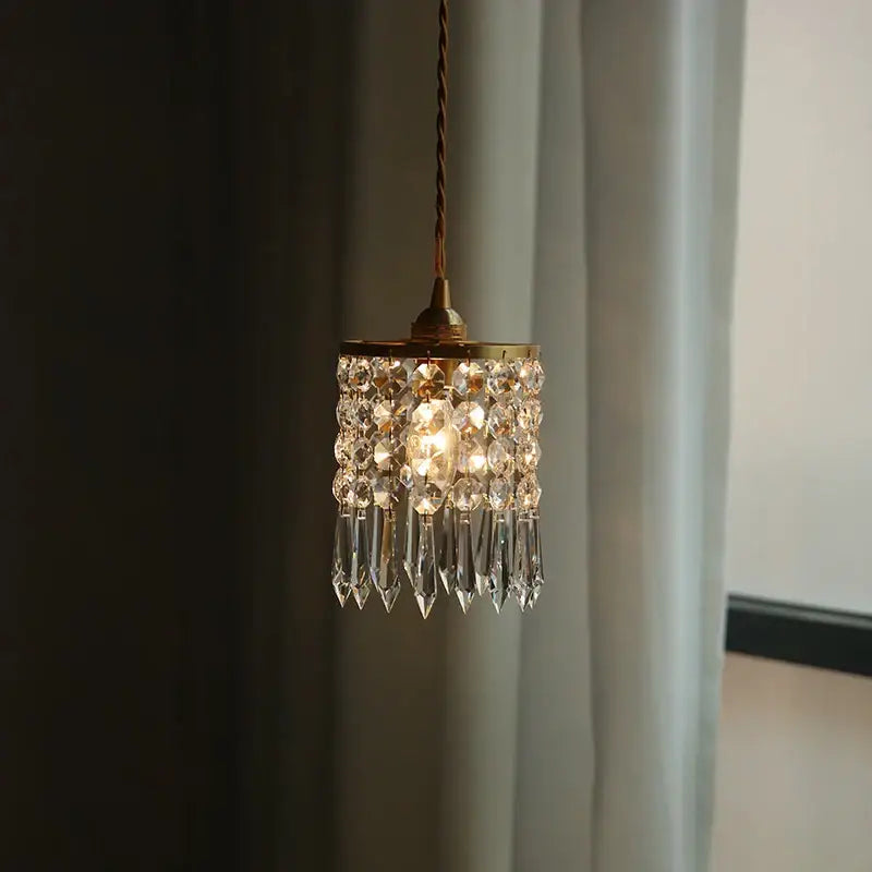 Modern crystal brass led pendant light with delicate brass frame and cascading clear faceted crystals for dining room decorbites crystal brass