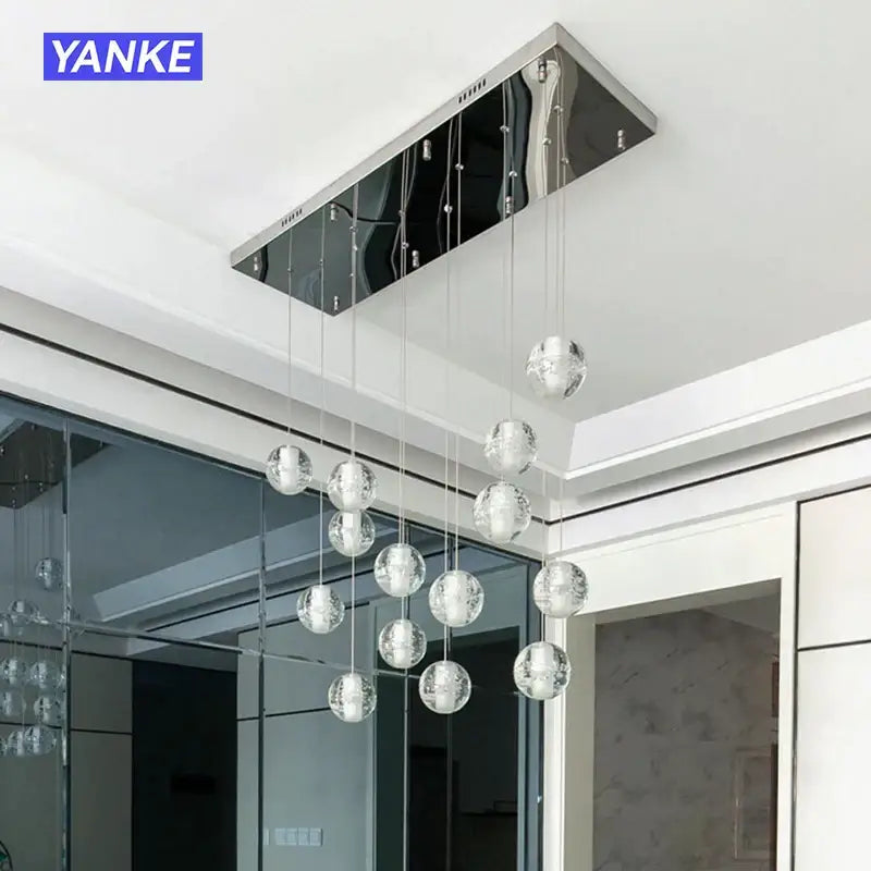Modern yanke pendant light with sleek chrome finish and multiple hanging decorbites crystal bubble spheres for dining room