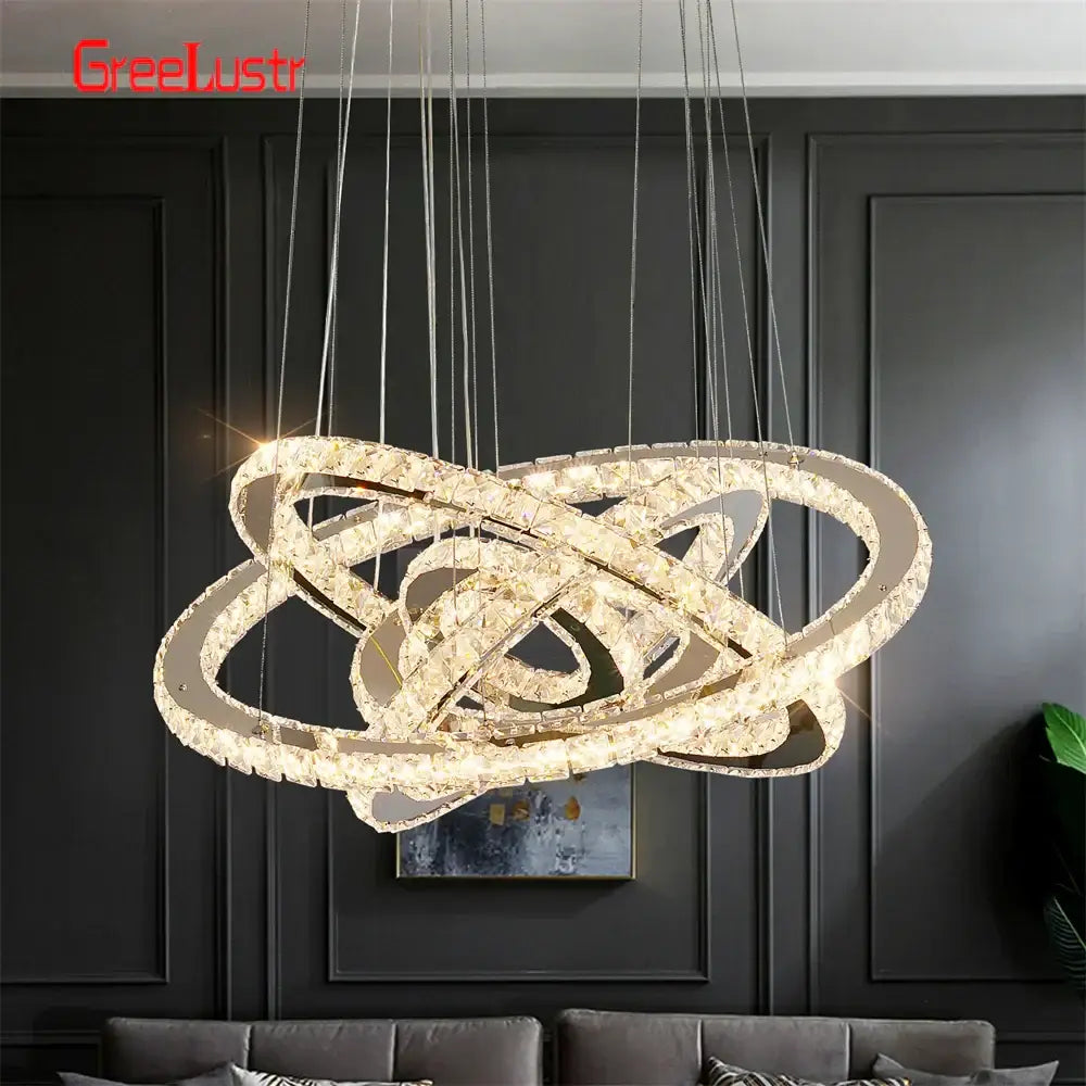 Modern crystal chrome led pendant light rings chandelier with interlocking rings and warm glow for living room decorbites crystal chrome