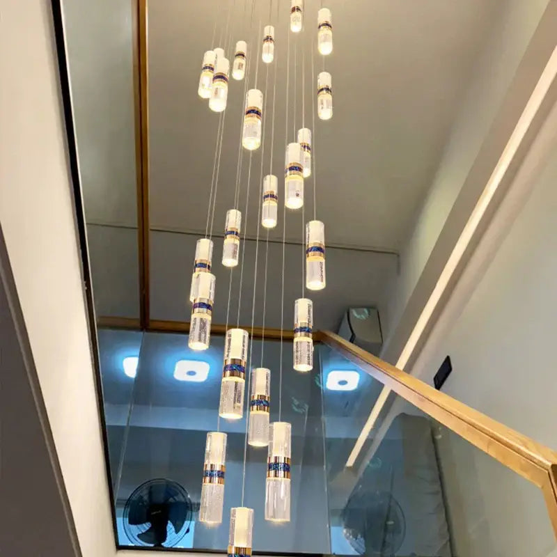 Modern crystal columnar chandelier stair lamp with clear glass shades and gold-toned decorbites crystal columnar accents
