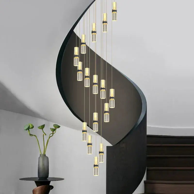 Modern spiral staircase with sleek black metal railings paired with decorbites crystal columnar chandelier stair lamp