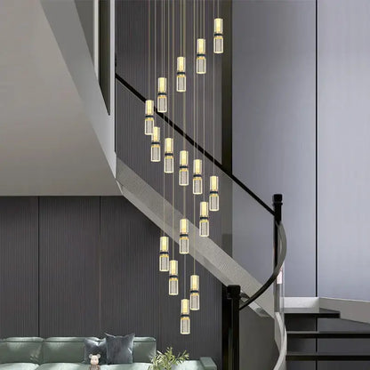 Modern crystal columnar chandelier with clear glass cylinders and gold-toned metallic accents for stairwell lighting