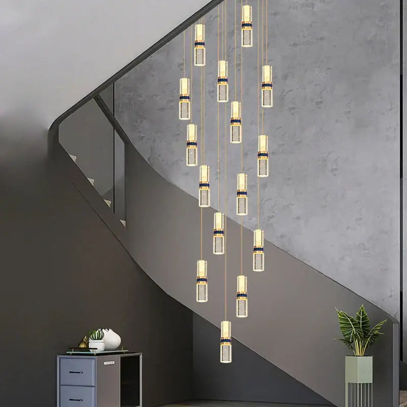 Modern crystal columnar chandelier with clear glass cylinders and gold-toned accents for stairwell decorbites crystal columnar