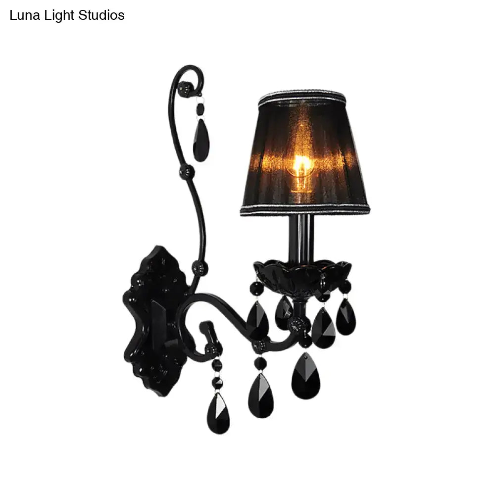 Black wrought iron modern crystal cone wall mount sconce with textured lampshade and teardrop crystals for living room