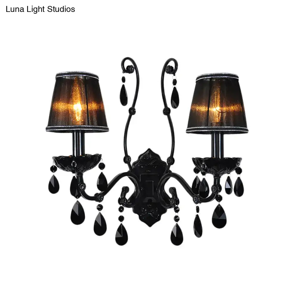 Black ornate modern crystal cone wall mount sconce with two lampshades and teardrop crystals for living room