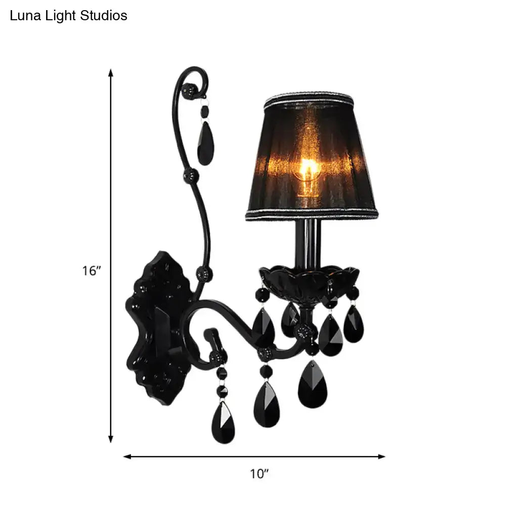 Black ornate modern crystal cone wall mount sconce with textured lampshade and dangling teardrop crystals for living room