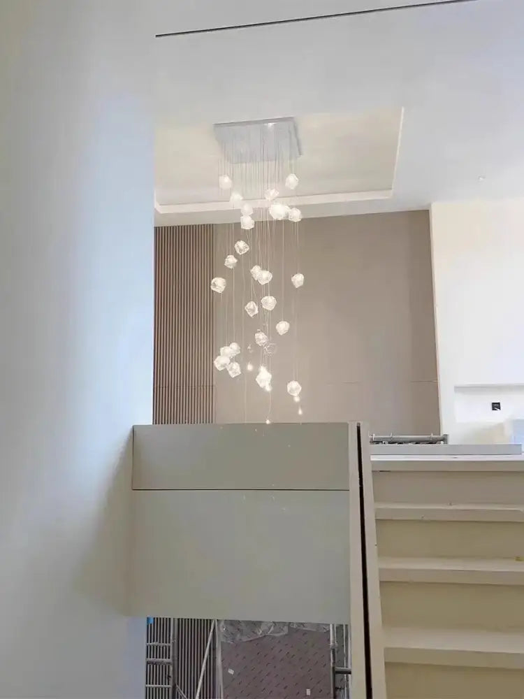 Modern crystal cube chandelier pendant lights with a sleek rectangular mount and soft white spherical glass orbs for dining decorbites cube chandelier