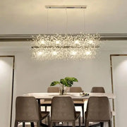 A modern crystal dandelion chandelier led hanging light with a sleek metallic frame and clear crystals for dining room decorbites