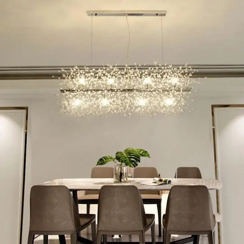 A modern crystal dandelion chandelier led hanging light with a sleek metallic frame and clear crystals for dining room decorbites