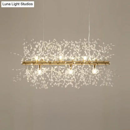 Elegant gold-toned DecorBites™ modern crystal flower island pendant ceiling lamp with delicate branches and warm bulbs